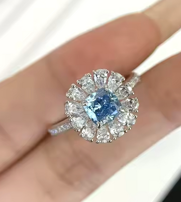 14kt White Gold Lab Blue Diamond Ring with Pear Shapes in the Halo